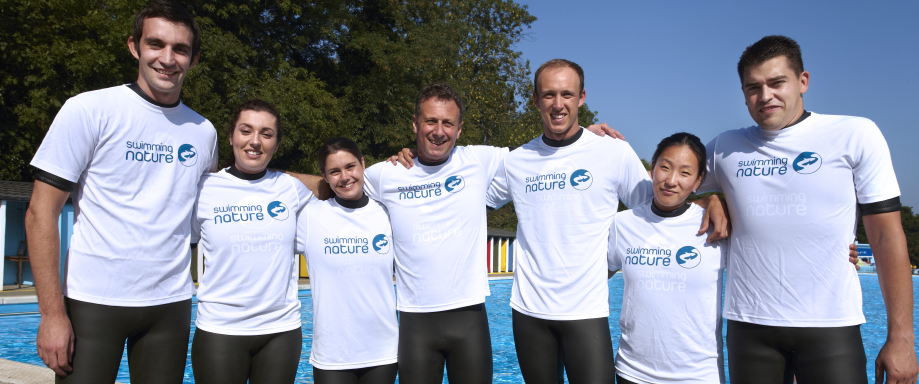 Swimming instructors standing in a line at Tooting Bec lido